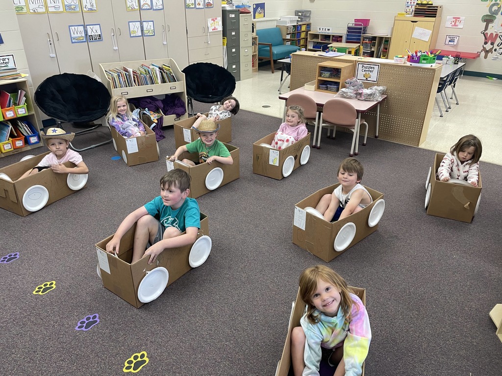 Students sitting in "box cars"